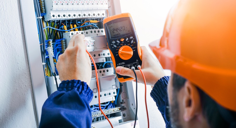 Electrician,Installing,Electric,Cable,Wires,And,Fuse,Switch,Box.,Multimeter